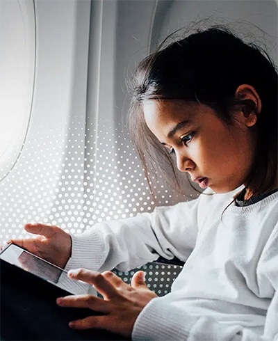 a girl looking at a tablet
