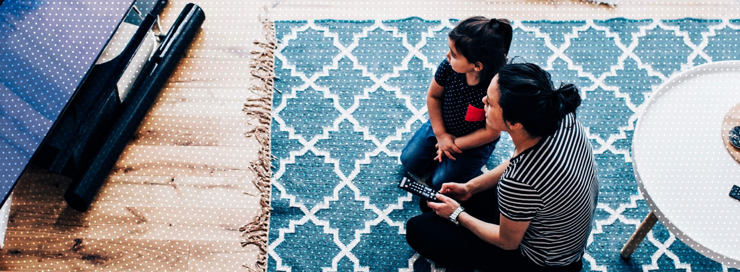 woman and girl watching TV