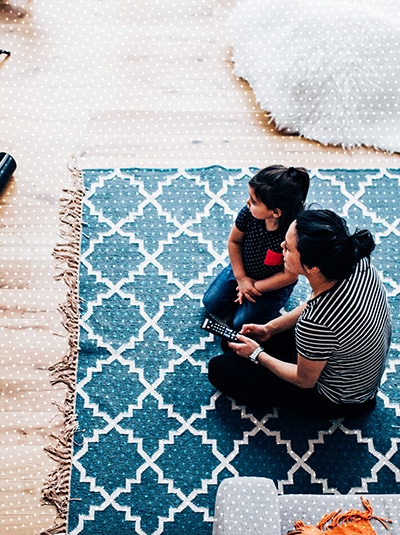 woman and girl watching TV