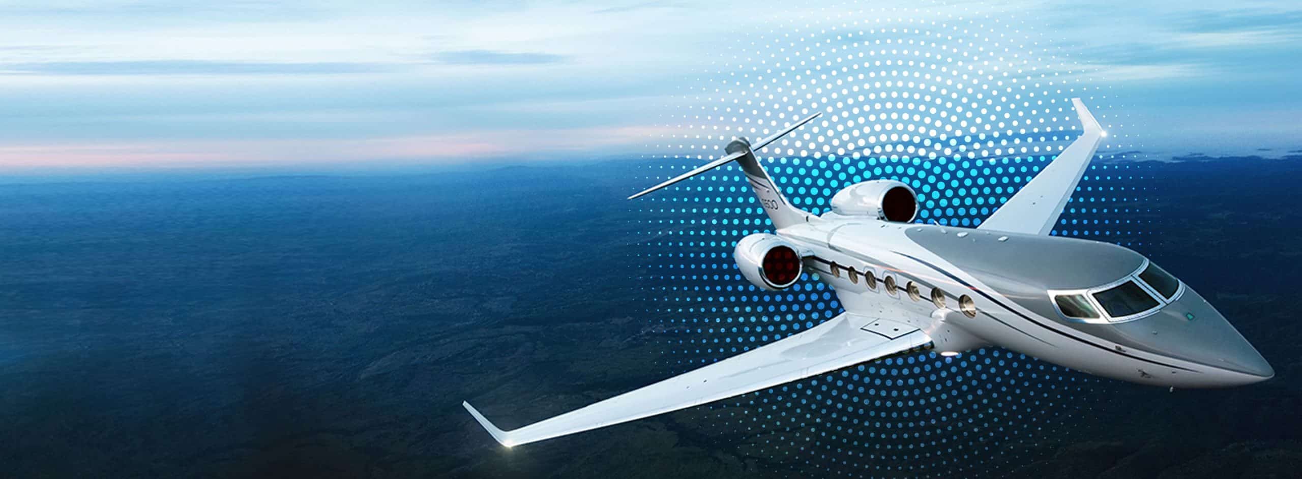 a white airplane flying over a blue sky