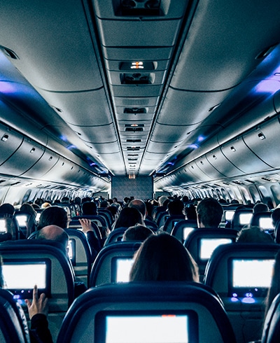 a group of people sitting in an airplane