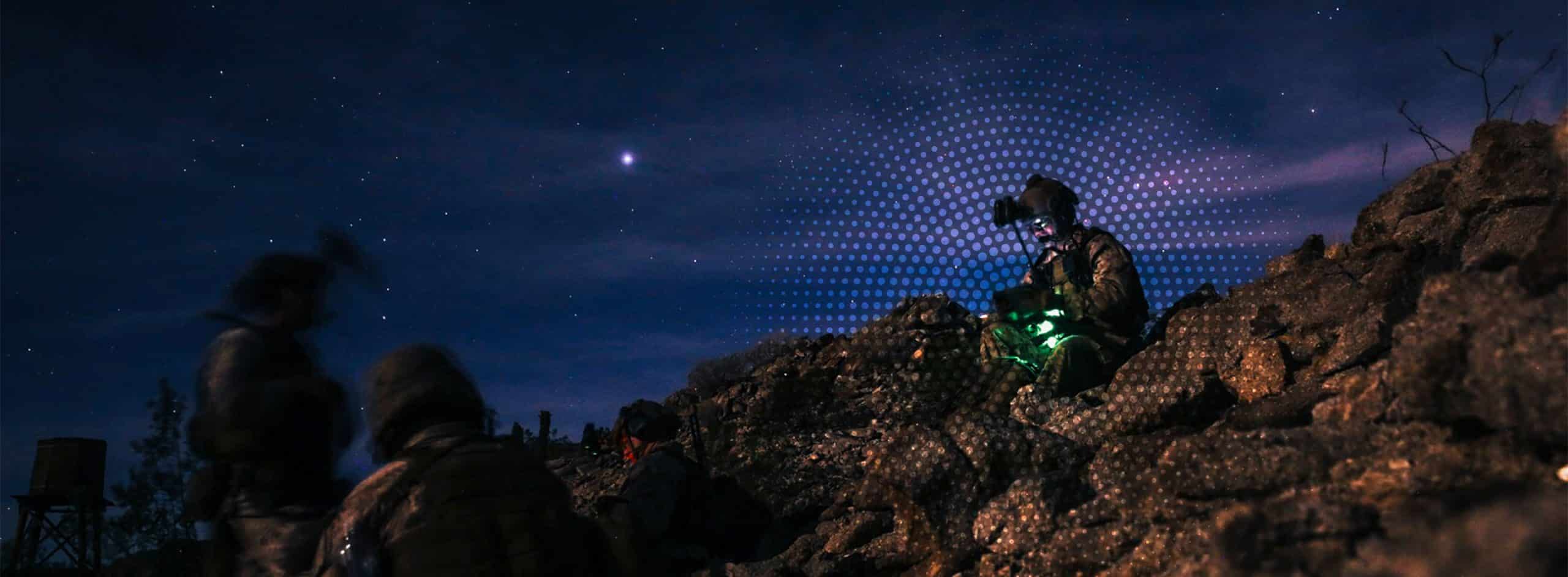soldiers on a hill at night