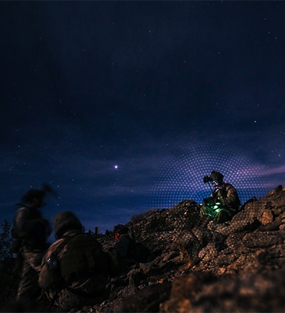soldiers on a hill at night