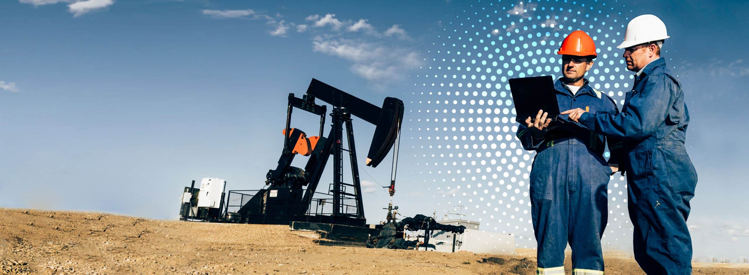 workers in front of oil pump