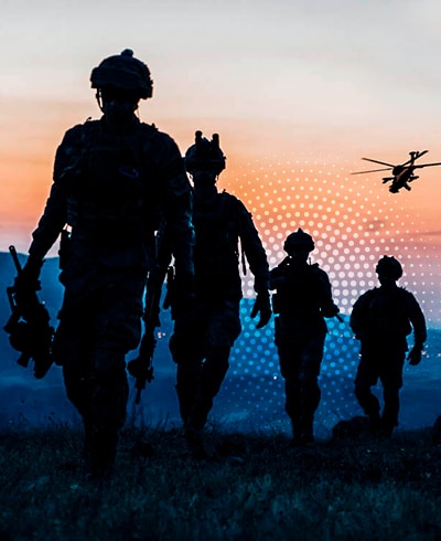 a group of soldiers walking in a field