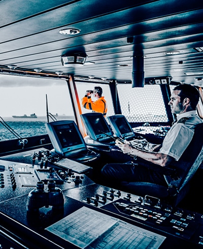 the bridge/command center of a cargo ship