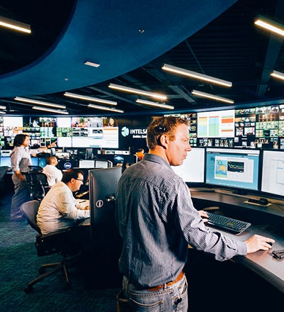 multiple people working in a satellite flight operations center